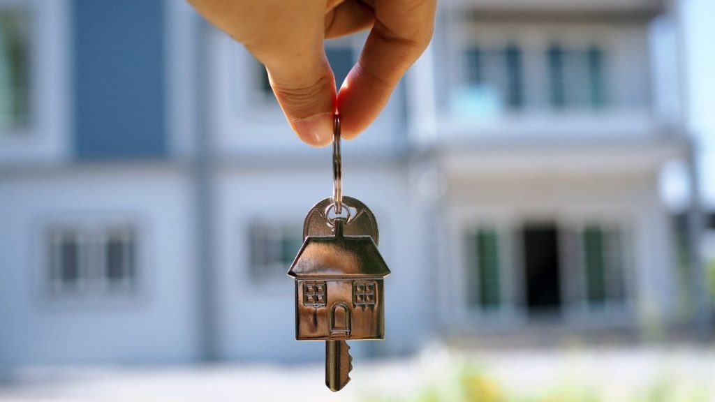 house shaped keychain and a key
